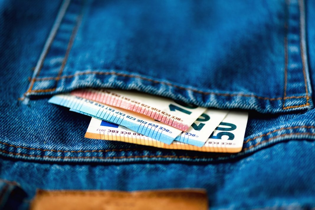 Euro banknotes in jeans pocket. Success, wealth and poverty, poorness concept. Euro currency background with copy space.
