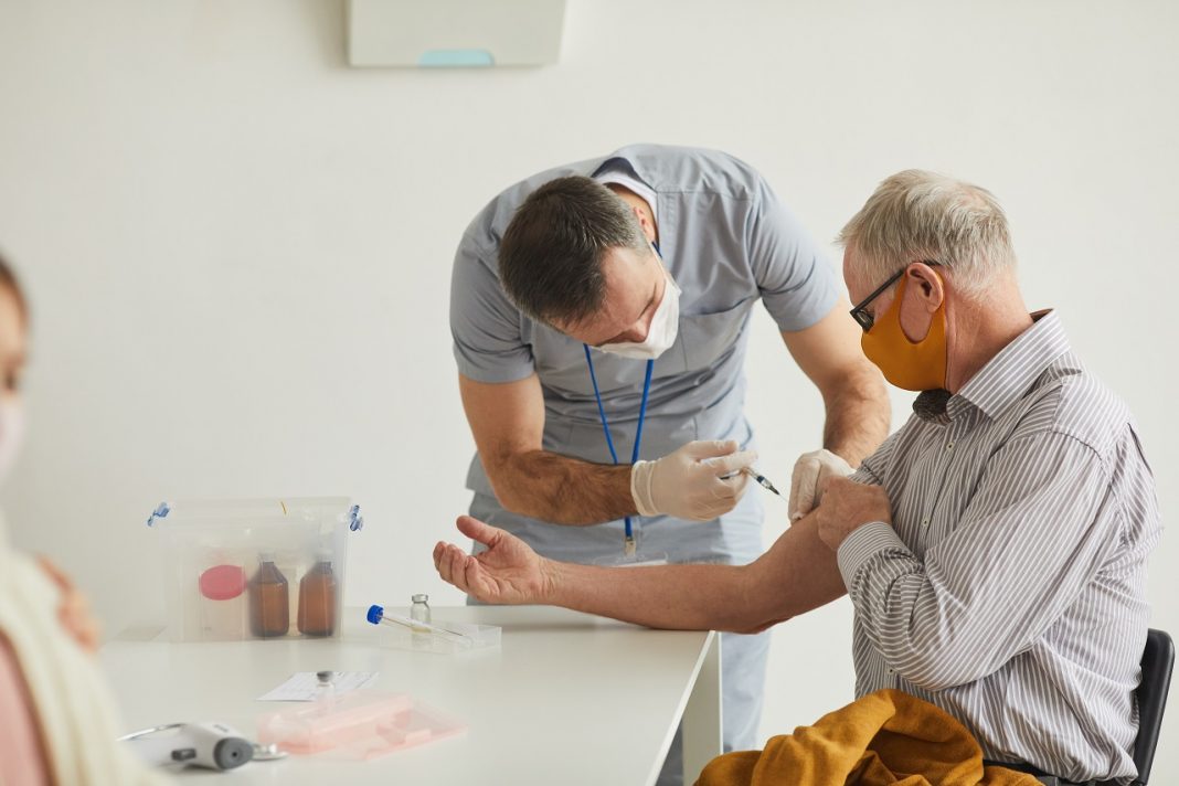 Senior Man Vaccinating Against Covid