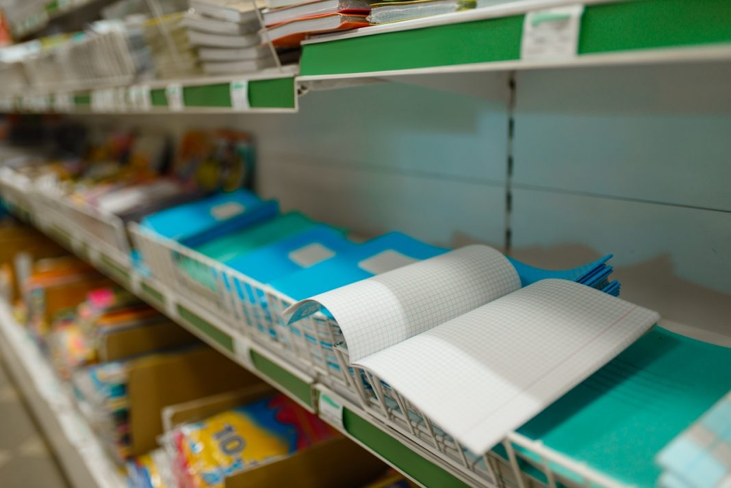 Shelf with notebooks in a cage, stationery store