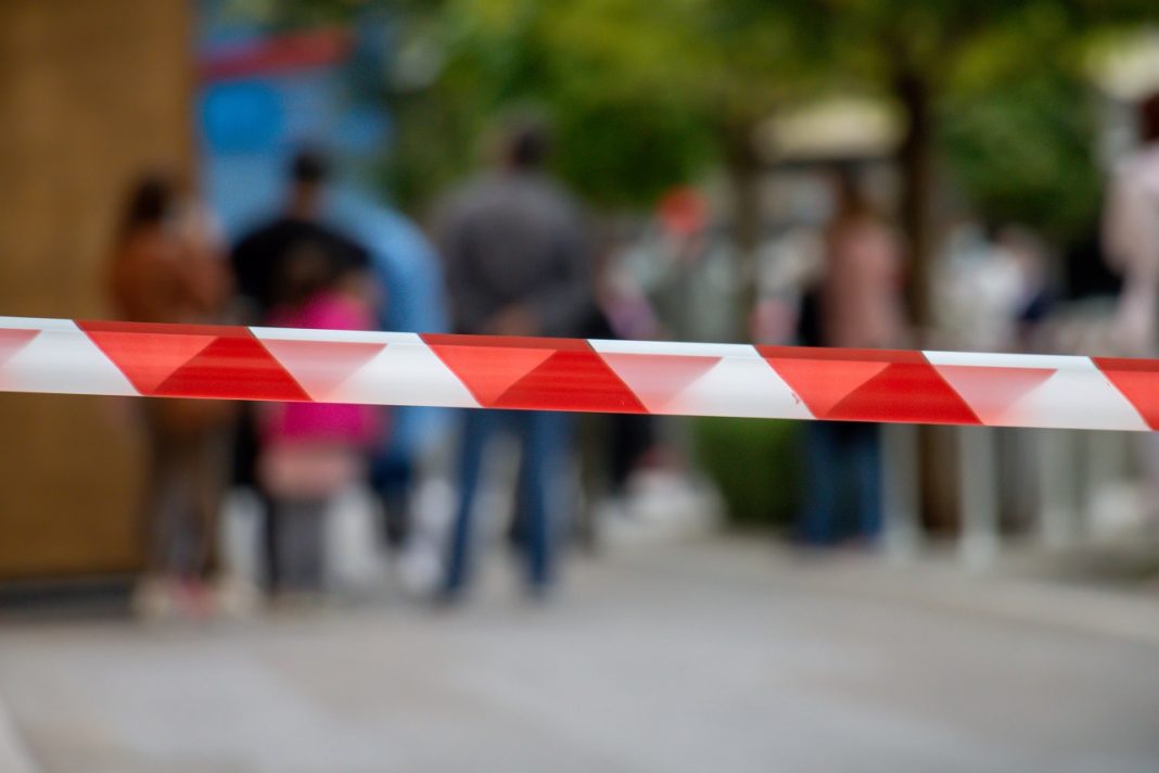 Red and white stripes warning tape, passage is prohibited concept.