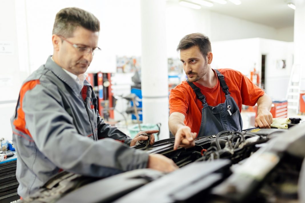 Car mechanic fixing a car