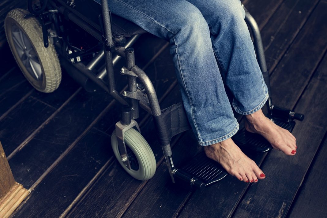 Handicapped woman sitting on a wheelchair