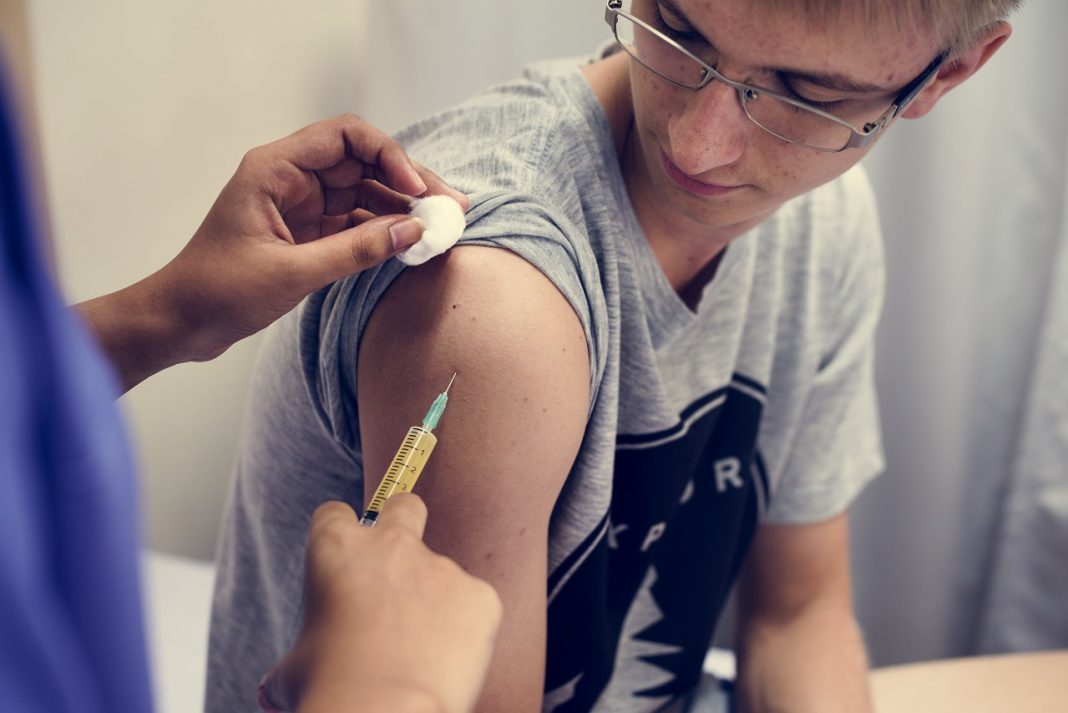 Young man having a vaccination