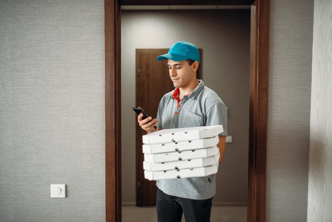 Pizza delivery boy calls to customer