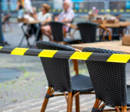 Sok dilemmával küzd a vendéglátás az újranyitás kapcsán Terraces in the city open again. Safety barrier tape on a terrac