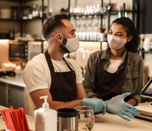 Az ország újraindulása elsősorban a szolgáltatók érdeke Coffee shop owners with face masks, lockdown, quarantine, coronavirus, back to normal concept