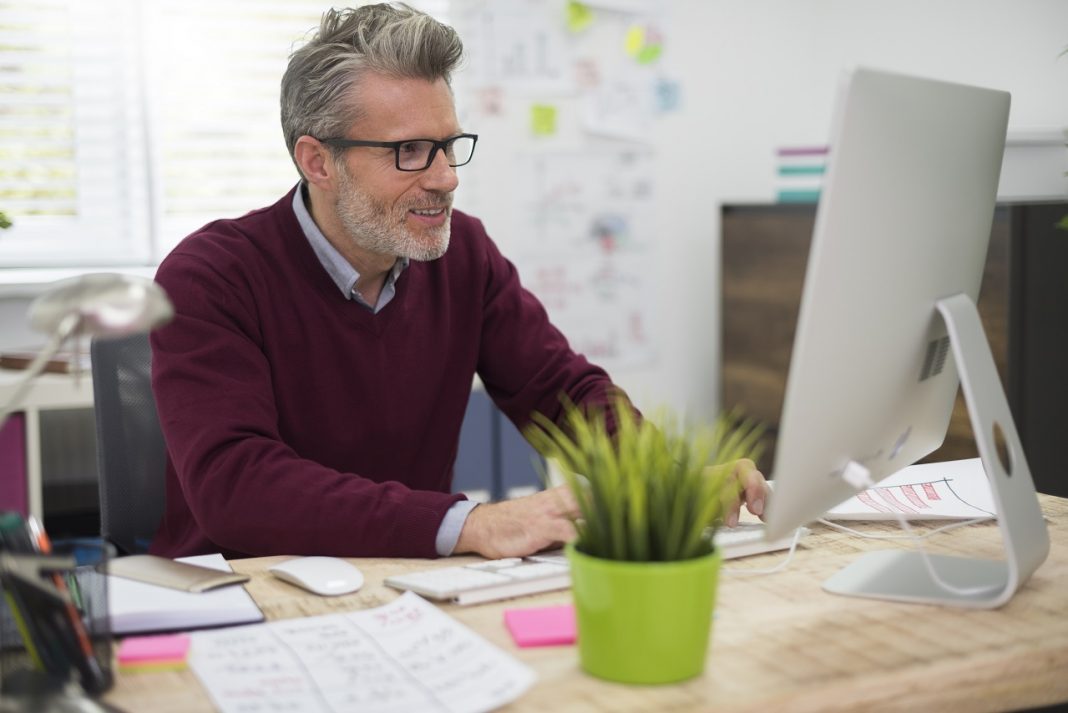 Satisfying job of cheerful man