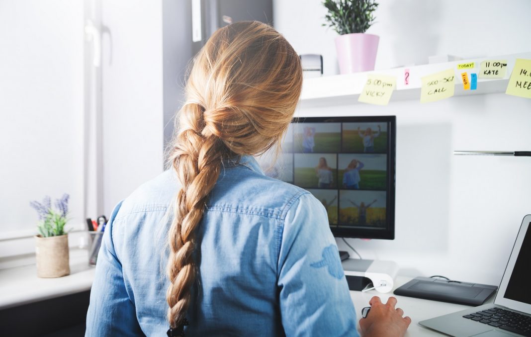 Woman working at home office desk