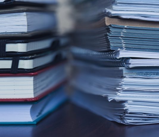 Kérelemmel menthető ki a május 31-ei határidő elmulasztása Accounting and taxes. Large pile of magazine and books