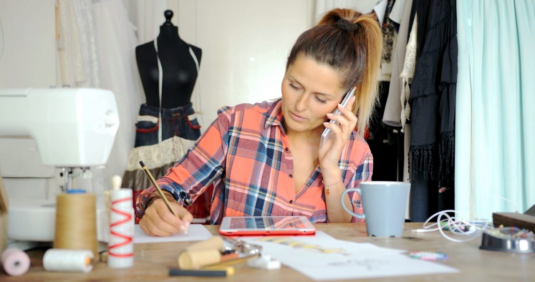 Busy tailor working in parlour